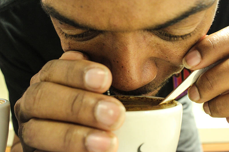 Man Savoring the Aroma of PJ's Coffee