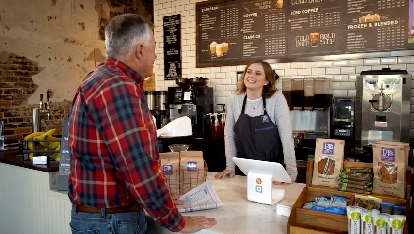 PJ's Coffee employee with customer